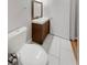 Small bathroom with toilet and a vanity with a mirror at 2416 Peachwood Ne Cir # 9, Atlanta, GA 30345