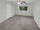Bedroom with grey carpet and a ceiling fan at 2416 Peachwood Ne Cir # 9, Atlanta, GA 30345