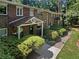 Brick building with multiple units, featuring a walkway and landscaping at 2416 Peachwood Ne Cir # 9, Atlanta, GA 30345
