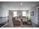 Spacious bonus room with sectional sofa and large windows at 1725 Prospect Way, Conyers, GA 30094