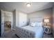 Cozy bedroom with a tufted headboard and built-in closet at 1725 Prospect Way, Conyers, GA 30094