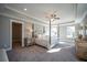 Bright main bedroom with a large walk-in closet and post bed at 1725 Prospect Way, Conyers, GA 30094