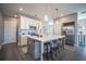 Modern kitchen with white cabinets, quartz island, and stainless steel appliances at 1725 Prospect Way, Conyers, GA 30094