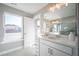 Elegant bathroom with marble shower, vanity, and large mirror at 1725 Prospect Way, Conyers, GA 30094