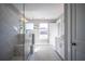 Spa-like bathroom featuring a walk-in marble shower and modern fixtures at 1725 Prospect Way, Conyers, GA 30094