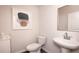 Modern powder room with pedestal sink and frameless mirror at 1600 Flint River Place Se Se Pl, Smyrna, GA 30126
