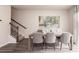 Dining room with wood table and gray chairs near staircase at 1600 Flint River Place Se Se Pl, Smyrna, GA 30126
