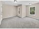 Spacious bedroom with gray carpeting and large windows at 4206 Weavers White Ln # 17, Austell, GA 30106