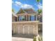 Stunning two-story home with stone accents and a three-car garage at 4206 Weavers White Ln # 17, Austell, GA 30106