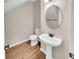 Powder room with pedestal sink and hardwood flooring at 4206 Weavers White Ln # 17, Austell, GA 30106