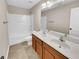 Bathroom with double vanity, tub, and updated fixtures at 4206 Weavers White Ln # 17, Austell, GA 30106
