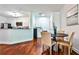 Open concept dining area features hardwood floors and a view of the kitchen at 3334 Peachtree Ne Rd # 704, Atlanta, GA 30326