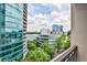 Balcony with partial city views and lush green trees at 3334 Peachtree Ne Rd # 704, Atlanta, GA 30326