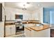 Modern kitchen with stainless steel appliances and granite countertops at 3334 Peachtree Ne Rd # 704, Atlanta, GA 30326