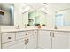Double vanity bathroom with updated fixtures and a shower at 3334 Peachtree Ne Rd # 704, Atlanta, GA 30326