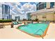 Inviting pool area with comfortable lounge chairs and city views at 3334 Peachtree Ne Rd # 704, Atlanta, GA 30326