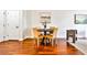 Modern dining area with dark wood table and neutral colored chairs at 3334 Peachtree Ne Rd # 704, Atlanta, GA 30326
