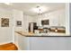 Modern kitchen with granite countertops and stainless steel appliances at 3334 Peachtree Ne Rd # 704, Atlanta, GA 30326