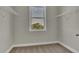 Bright walk-in closet with window and wire shelving at 1610 Habersham Villa Dr, Cumming, GA 30041