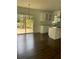 Kitchen with island, hardwood floors, and access to a deck at 4604 Shumart Dr, Snellville, GA 30039