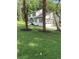 Two story house with white siding, gray roof, and landscaping at 4604 Shumart Dr, Snellville, GA 30039