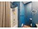 Bathroom with shower/tub combo and blue walls at , Hiram, GA 30141