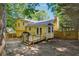 Yellow house with wooden deck and fenced backyard at , Hiram, GA 30141