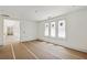 Bright and airy interior room with large windows and hardwood floors at 825 Kenry Ct, Atlanta, GA 30342