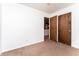 Simple bedroom with neutral walls and carpet at 146 Mount Bethel Rd, Mcdonough, GA 30252