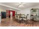 Bright dining room with hardwood floors and a glass-top table at 146 Mount Bethel Rd, Mcdonough, GA 30252