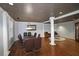 Elegant dining room with dark wood table, leather chairs, and decorative columns at 1735 Peachtree Ne St # 210, Atlanta, GA 30309