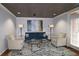 Sophisticated living room featuring a blue velvet sofa and a glass coffee table at 1735 Peachtree Ne St # 210, Atlanta, GA 30309