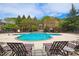 Community pool with lounge chairs and surrounding landscaping at 1735 Peachtree Ne St # 210, Atlanta, GA 30309