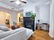 Living area with hardwood floors, sectional sofa, and fireplace at 1735 Peachtree Ne St # 210, Atlanta, GA 30309
