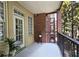 Private balcony with brick and neutral colored walls at 1735 Peachtree Ne St # 210, Atlanta, GA 30309