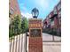 Community entrance with brick pillars, gate and signage at 1735 Peachtree Ne St # 210, Atlanta, GA 30309
