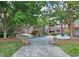 Courtyard with fountain, benches, and lush landscaping at 1735 Peachtree Ne St # 210, Atlanta, GA 30309