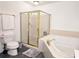 Bathroom with a large corner jacuzzi bathtub and a separate glass shower at 1735 Peachtree Ne St # 210, Atlanta, GA 30309
