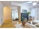 Living room with a large mirror, fireplace, and sectional sofa at 1735 Peachtree Ne St # 210, Atlanta, GA 30309
