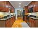 Modern kitchen with dark wood cabinets and granite countertops at 1735 Peachtree Ne St # 210, Atlanta, GA 30309