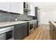 Modern kitchen with stainless steel appliances and gray cabinets at 788 W Marietta Nw St # 714, Atlanta, GA 30318