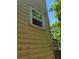 Beige house exterior with multiple windows and surrounding green space at 2159 Martin Luther King, Jr. Dr, Atlanta, GA 30310
