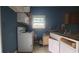 Kitchen with white cabinets, appliances, and wood countertop at 2159 Martin Luther King, Jr. Dr, Atlanta, GA 30310
