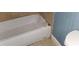 A white bathtub with tiled surround at 2159 Martin Luther King, Jr. Dr, Atlanta, GA 30310