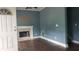 Living room with fireplace and hardwood floors at 2159 Martin Luther King, Jr. Dr, Atlanta, GA 30310