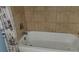 A white bathtub with tiled surround at 2159 Martin Luther King, Jr. Dr, Atlanta, GA 30310