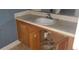 A bathroom vanity with a sink and wooden cabinets at 2159 Martin Luther King, Jr. Dr, Atlanta, GA 30310
