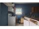 Kitchen with white cabinets, appliances, and wood countertop at 2159 Martin Luther King, Jr. Dr, Atlanta, GA 30310