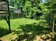 Spacious backyard with a wooden fence and lush green grass at 2159 Martin Luther King, Jr. Dr, Atlanta, GA 30310