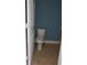 A small bathroom with a toilet and tiled floor at 2159 Martin Luther King, Jr. Dr, Atlanta, GA 30310